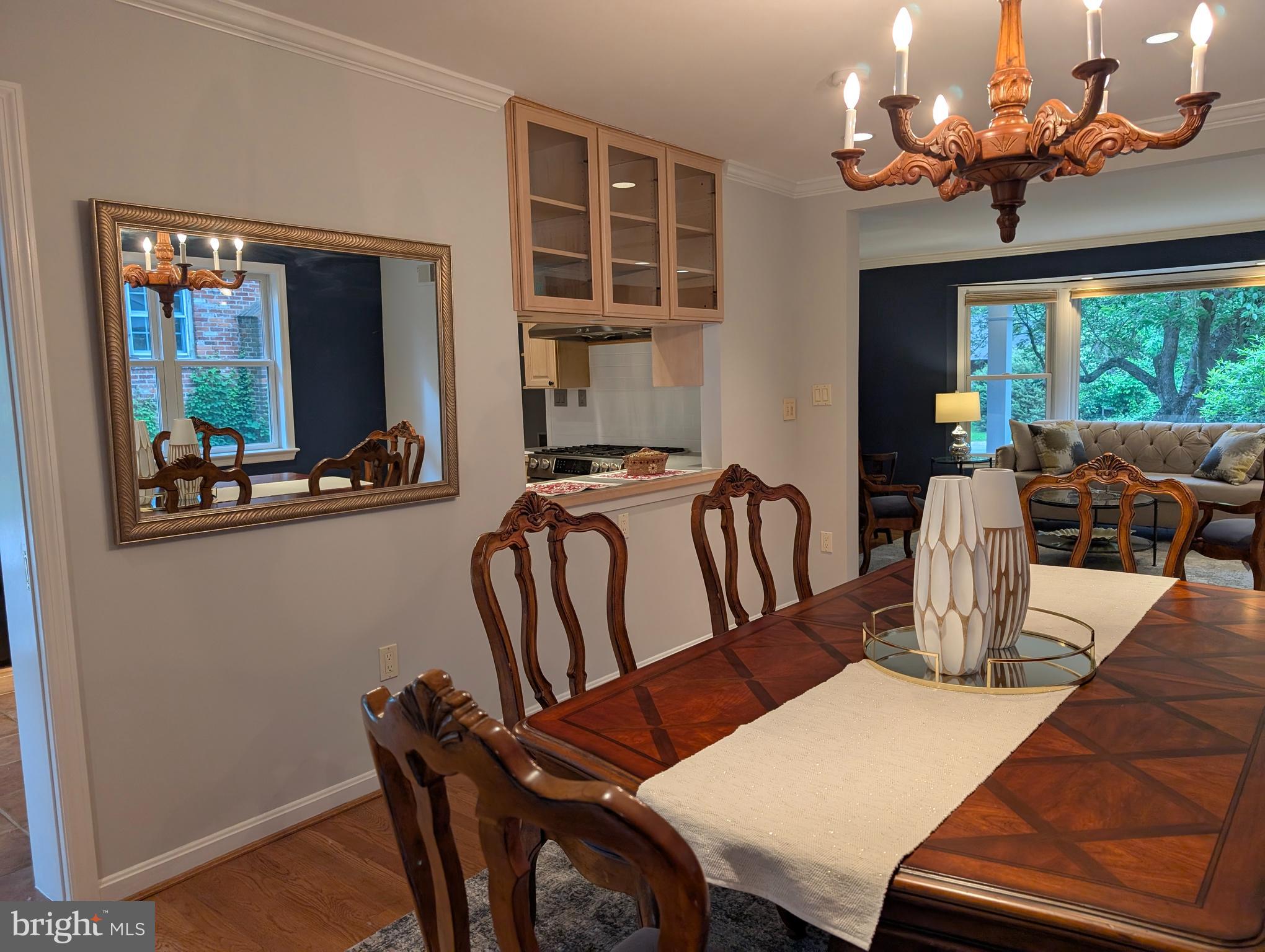 9510 Clement Road Silver Spring, MD 20910 - Photo 9 of 80 a view of a dining room with furniture wooden floor and chandelier