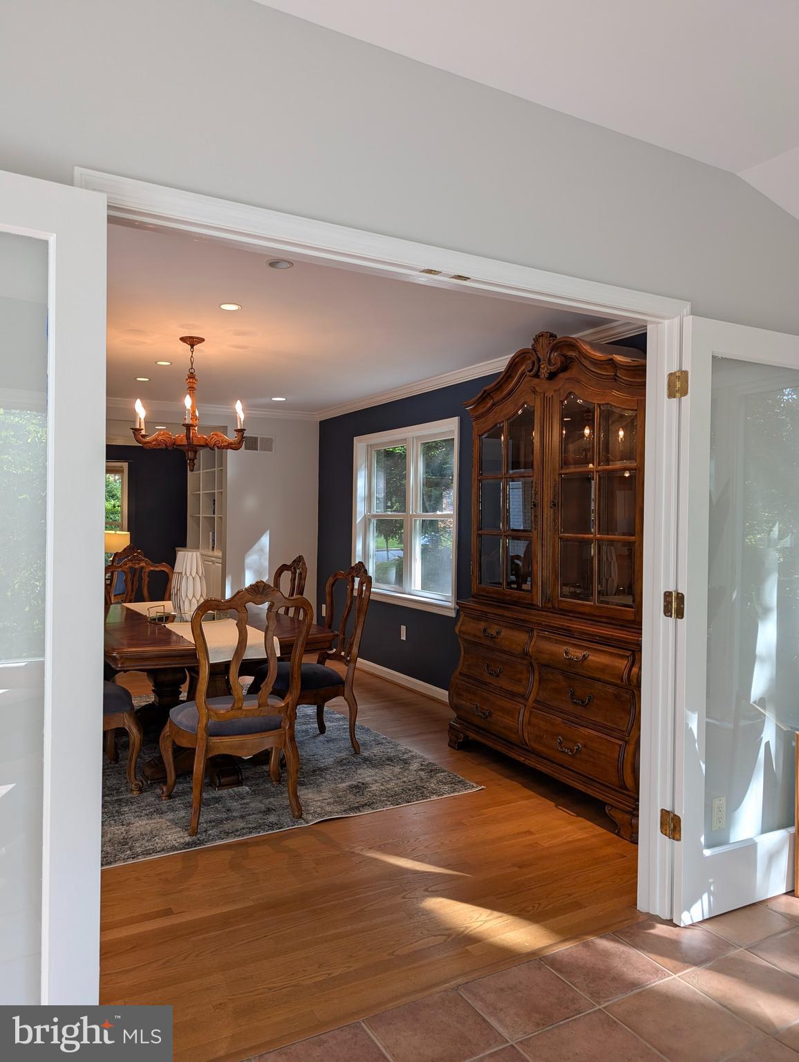 9510 Clement Road Silver Spring, MD 20910 - Photo 10 of 80 a view of a dining room with furniture window and wooden floor