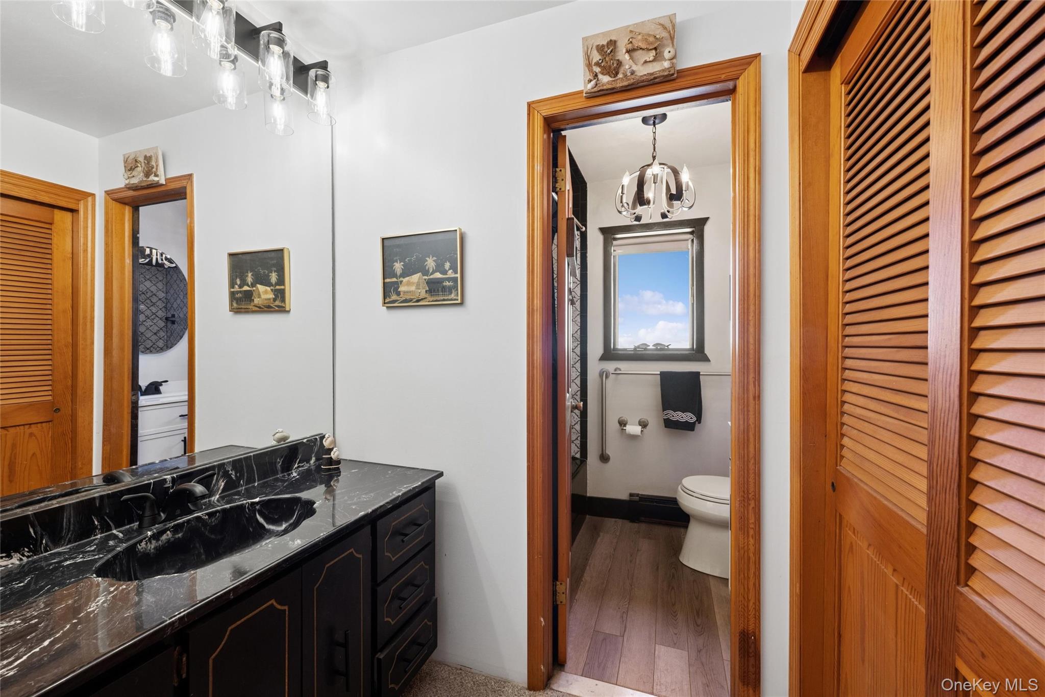 171 Harbor Beach Road Mount Sinai, NY 11766 - Photo 27 of 46 main floor hall dressing area, double laundry closet, sink, vanity. door for privacy in shower & toilet