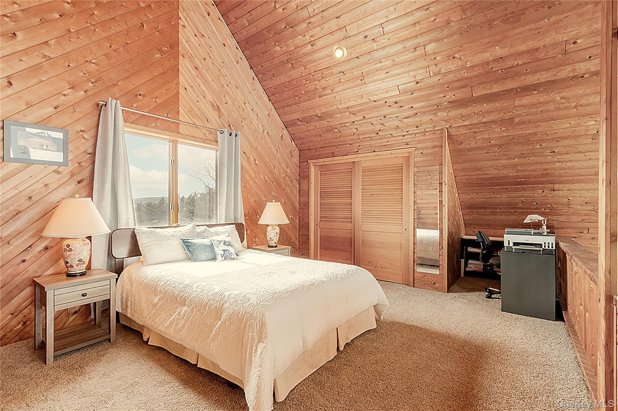 171 Harbor Beach Road Mount Sinai, NY 11766 - Photo 28 of 43 a bedroom with a bed and a large window