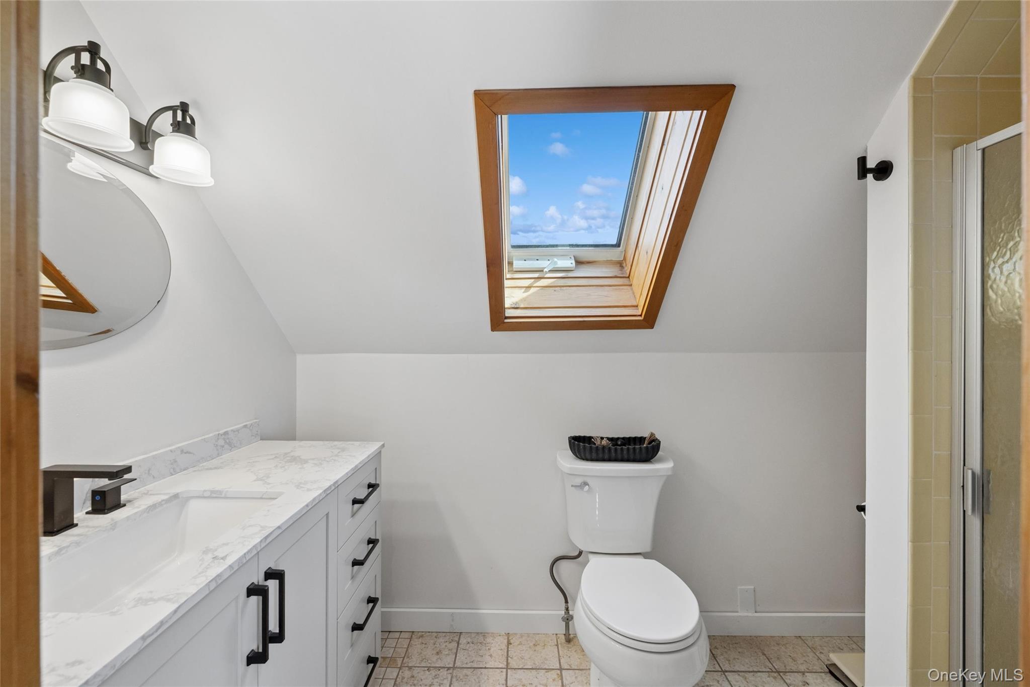 171 Harbor Beach Road Mount Sinai, NY 11766 - Photo 29 of 43 a bathroom with a toilet a sink and mirror