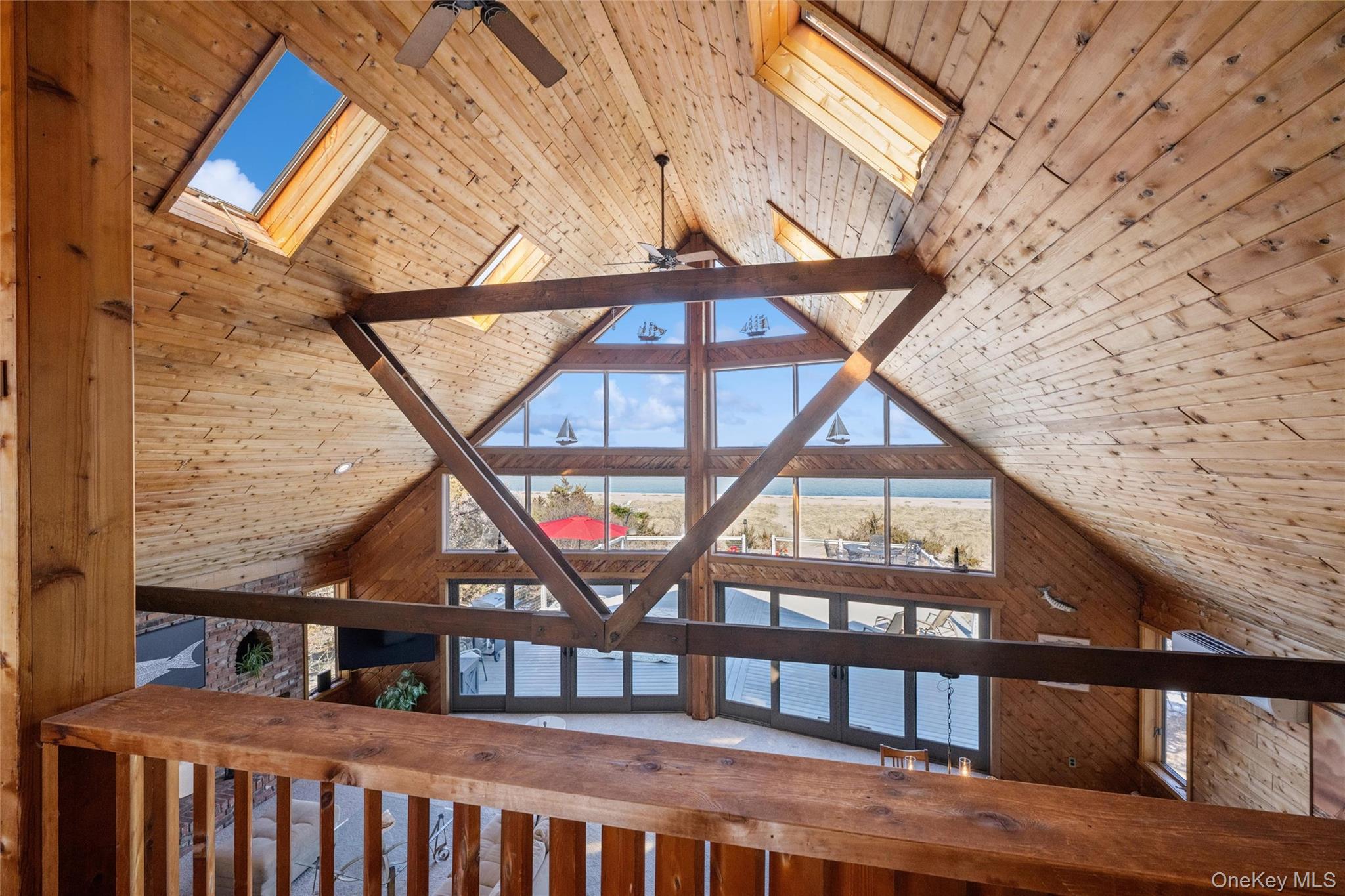 171 Harbor Beach Road Mount Sinai, NY 11766 - Photo 32 of 46 balcony overlooking vaulted ceiling with skylights and non stop water views!
