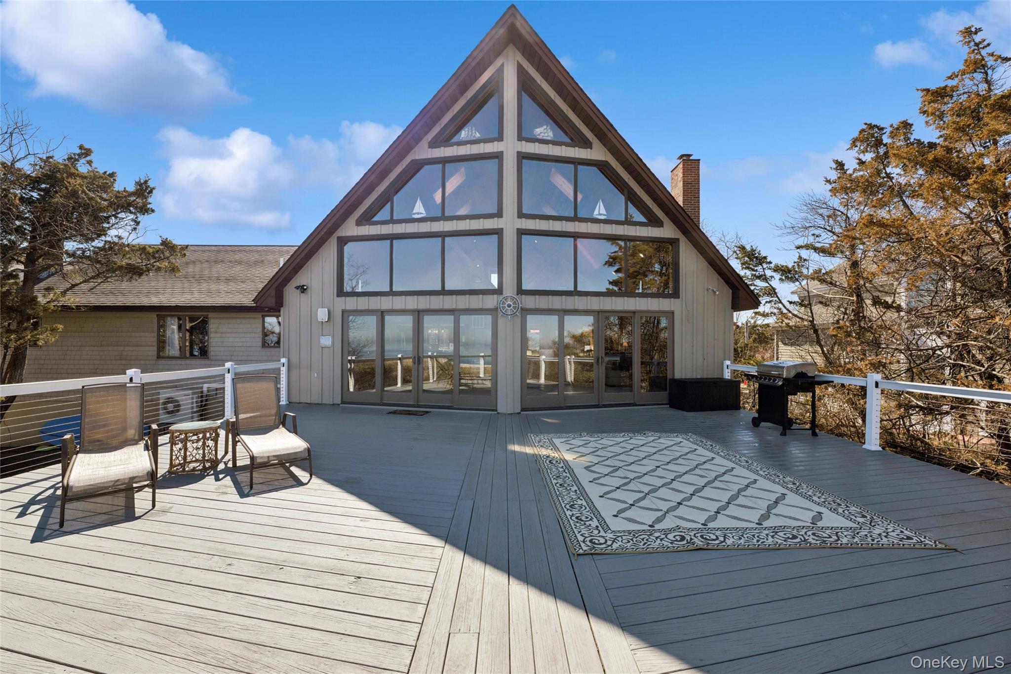 171 Harbor Beach Road Mount Sinai, NY 11766 - Photo 4 of 43 Front of home faces onto a 40'x45' deck overlooking the Long Island Sound