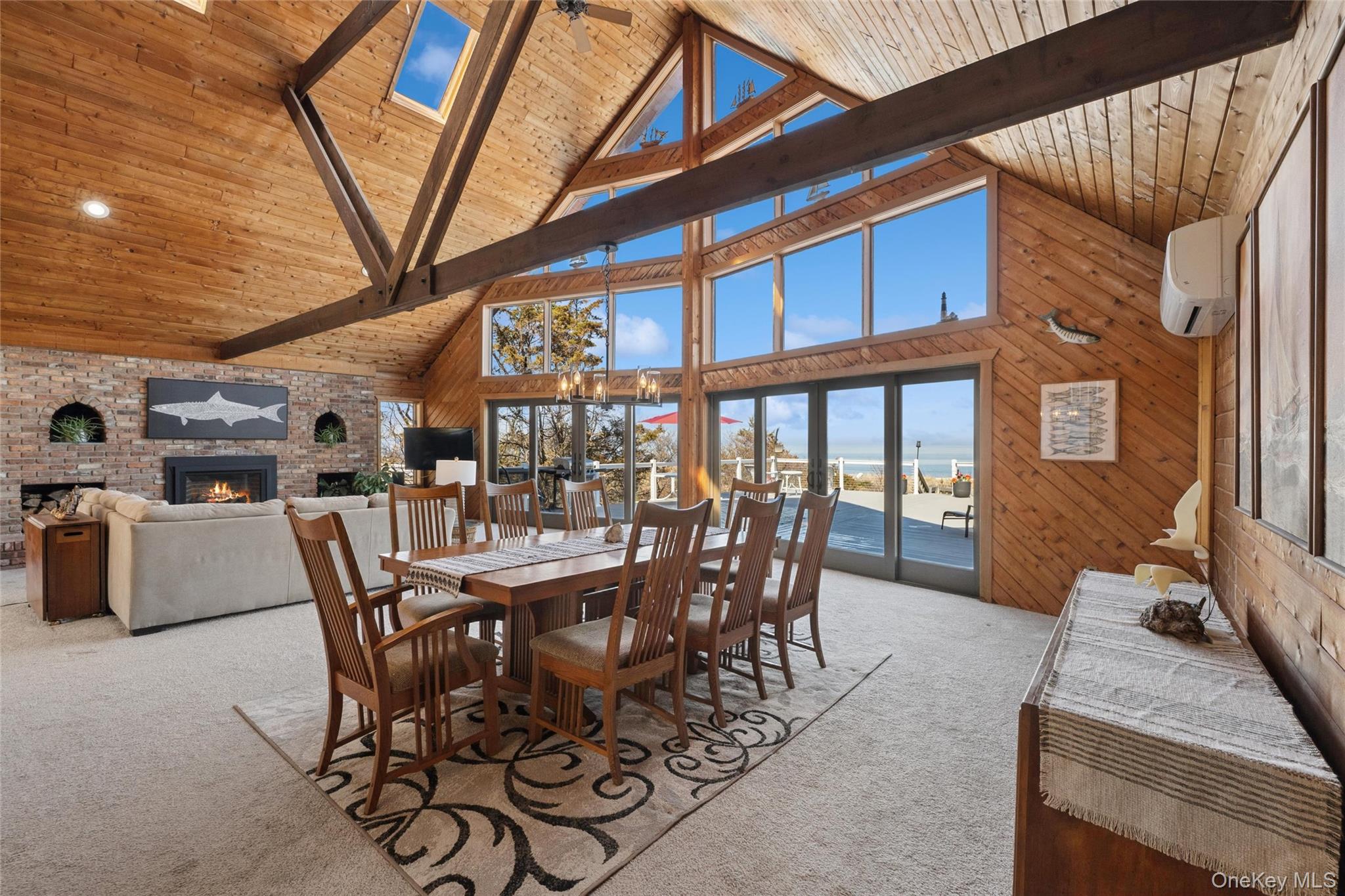 171 Harbor Beach Road Mount Sinai, NY 11766 - Photo 7 of 43 a dining room with furniture and a floor to ceiling window