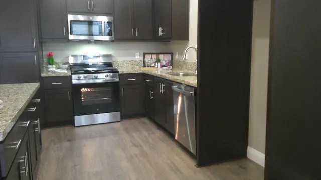 a bathroom with a sink vanity and a toilet