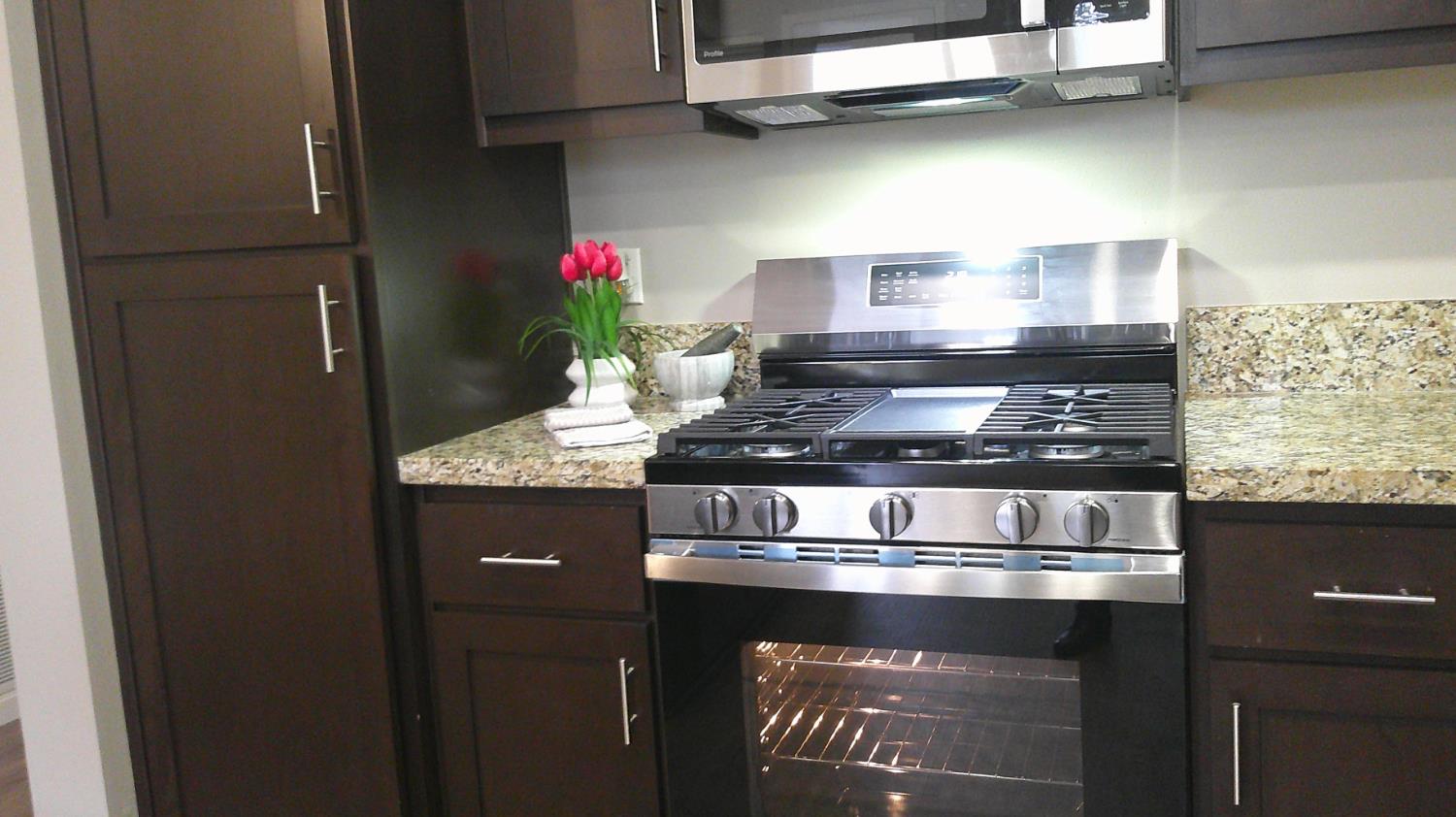 140 Ivy Avenue, Unit 39 Patterson, CA 95363 - Photo 14 of 47 a closeup of a stove