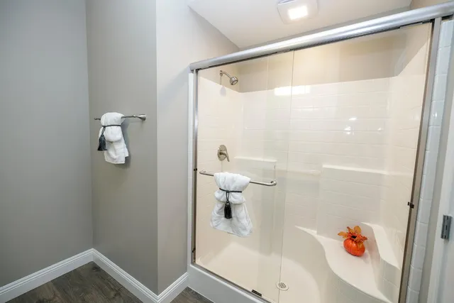 a bathroom with a shower and toilet