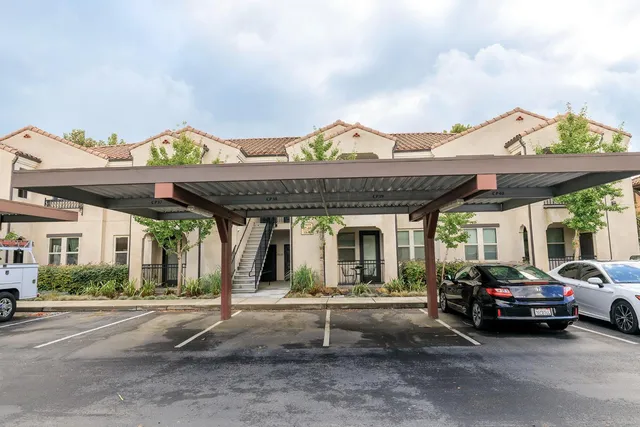 a view of a car park in front of house