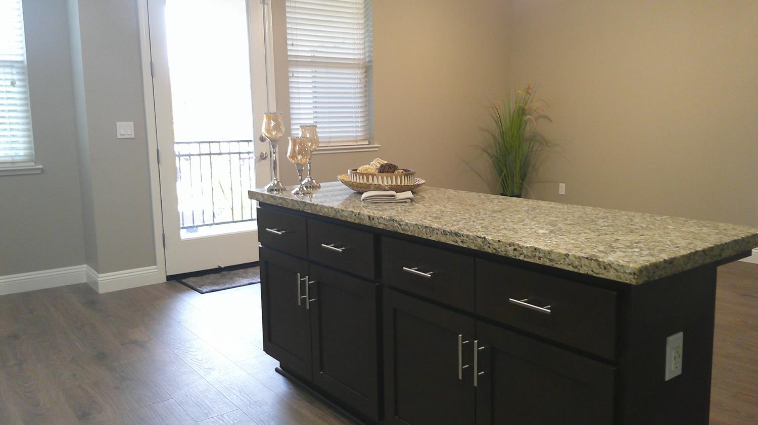 140 Ivy Avenue, Unit 39 Patterson, CA 95363 - Photo 9 of 47 The gourmet kitchen is a Chef's dream featuring this versatile island offering a breakfast bar & abundant Cherrywood cabinetry along with additional outlets.