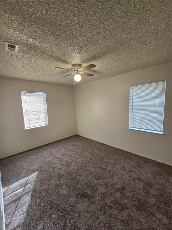 3827 Black Oak Drive Dallas, TX 75241 - Photo 6 of 11 an empty room with windows