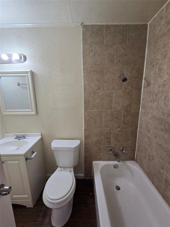 3827 Black Oak Drive Dallas, TX 75241 - Photo 9 of 11 a bathroom with a sink toilet and shower