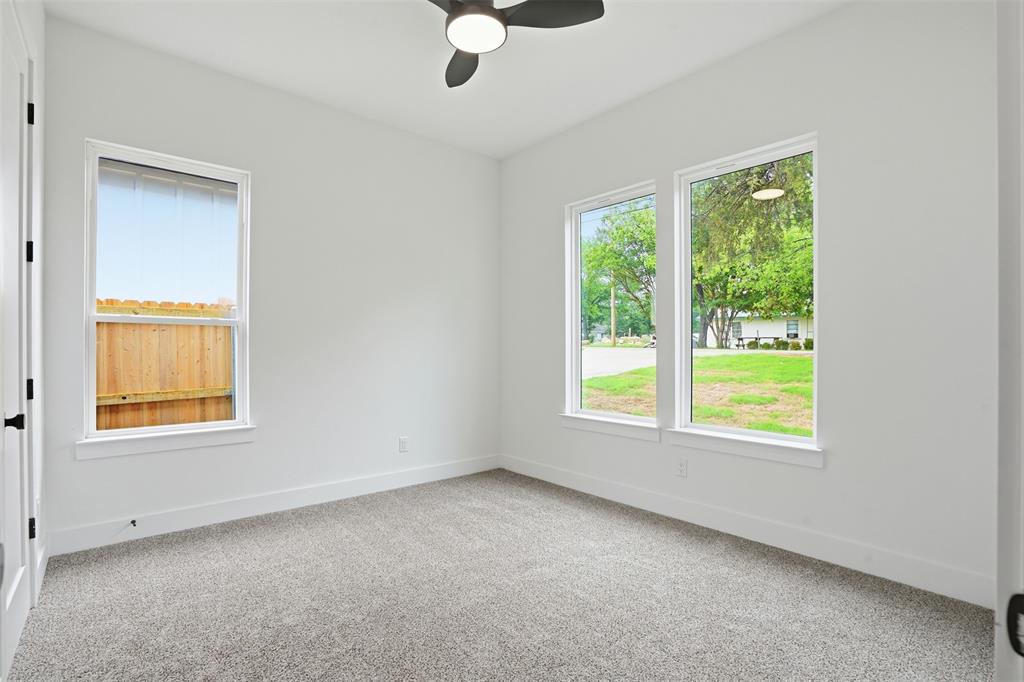 1111 Riverwood Road Dallas, TX 75217 - Photo 36 of 40 Carpeted room with a ceiling fan
