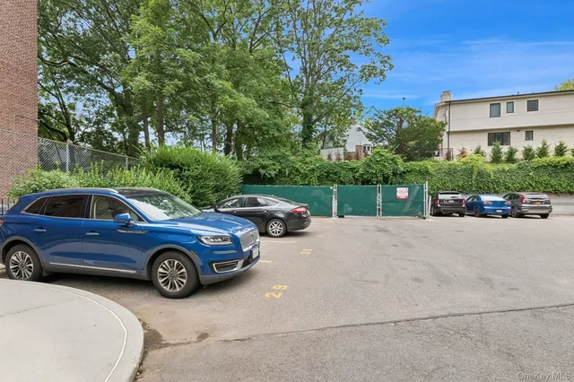 a view of a car parked in front of a building