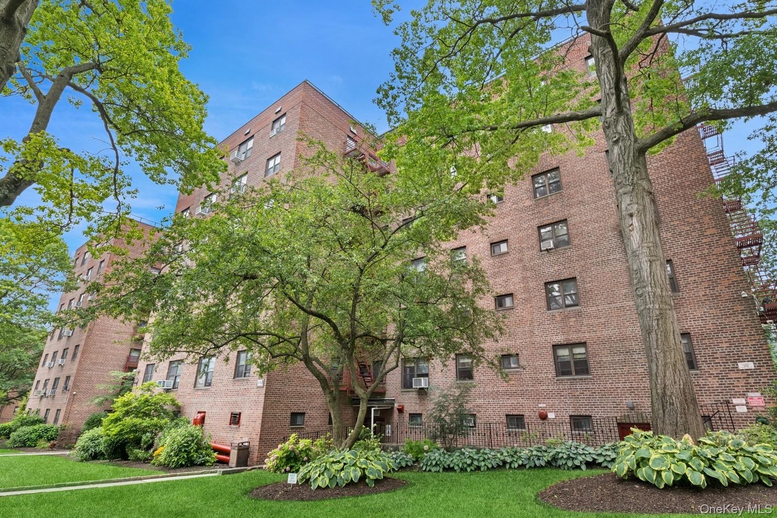 87-30 204th Street, Unit A78 Queens, NY 11423 - Photo 14 of 14 a front view of a house with a garden