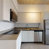 a kitchen with a refrigerator and a sink