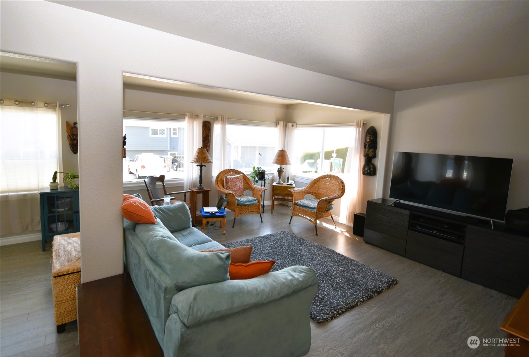 8124 East Daniels Loop Port Orchard, WA 98366 - Photo 11 of 24 a living room with furniture and a flat screen tv
