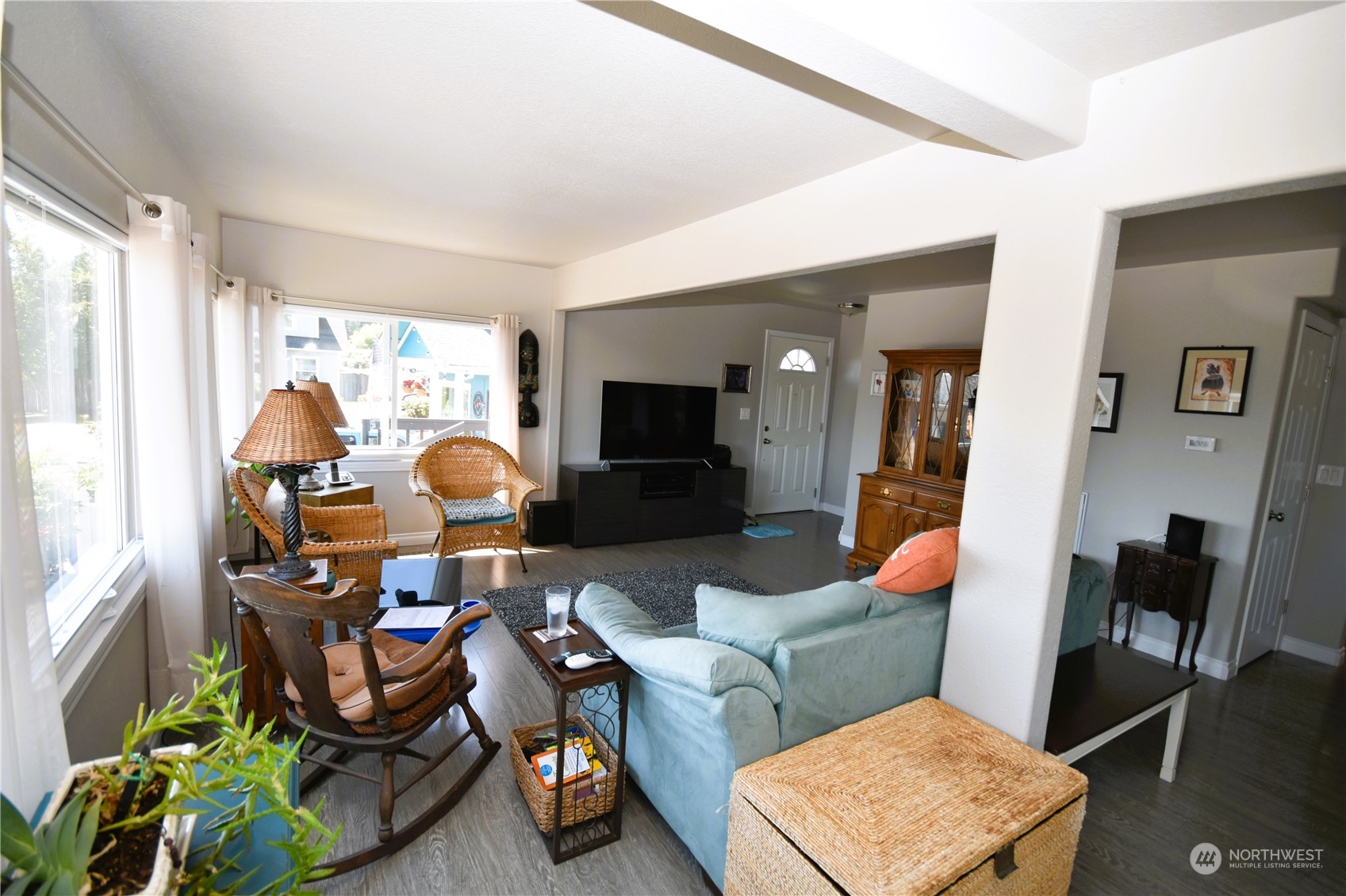 8124 East Daniels Loop Port Orchard, WA 98366 - Photo 12 of 24 a living room with furniture and a flat screen tv