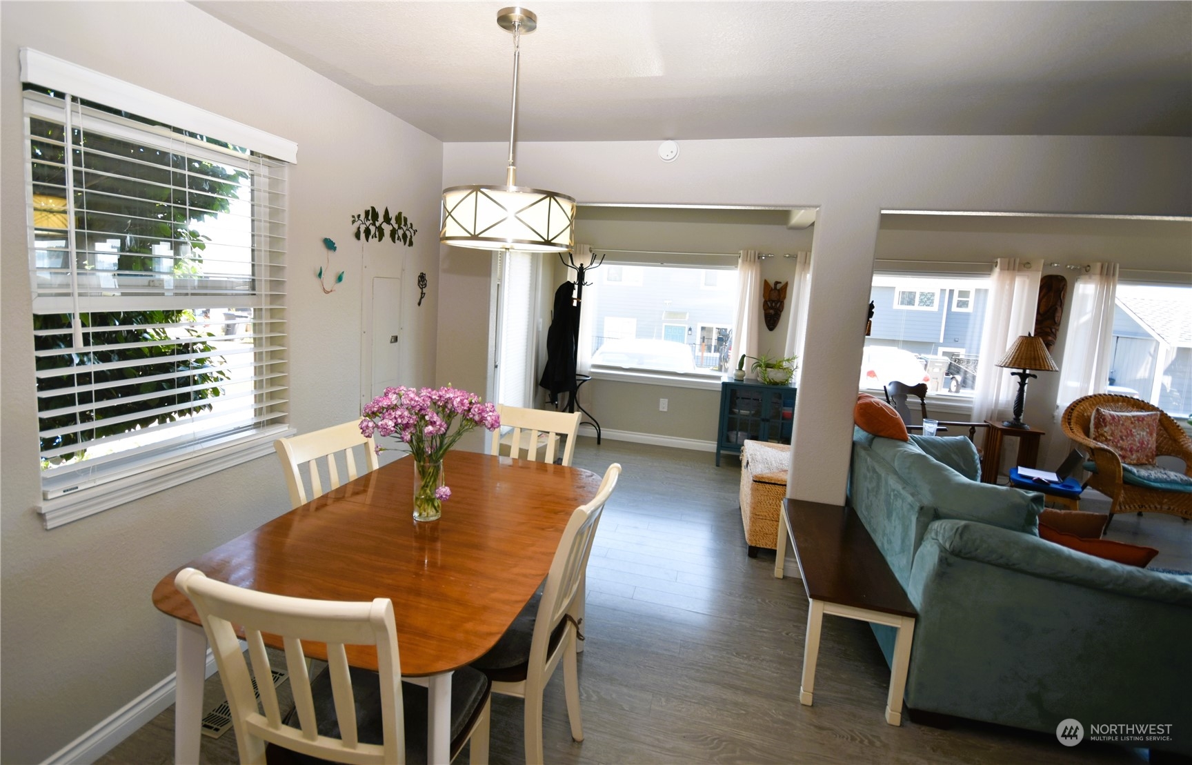 8124 East Daniels Loop Port Orchard, WA 98366 - Photo 13 of 24 a view of a dining room with furniture window and wooden floor