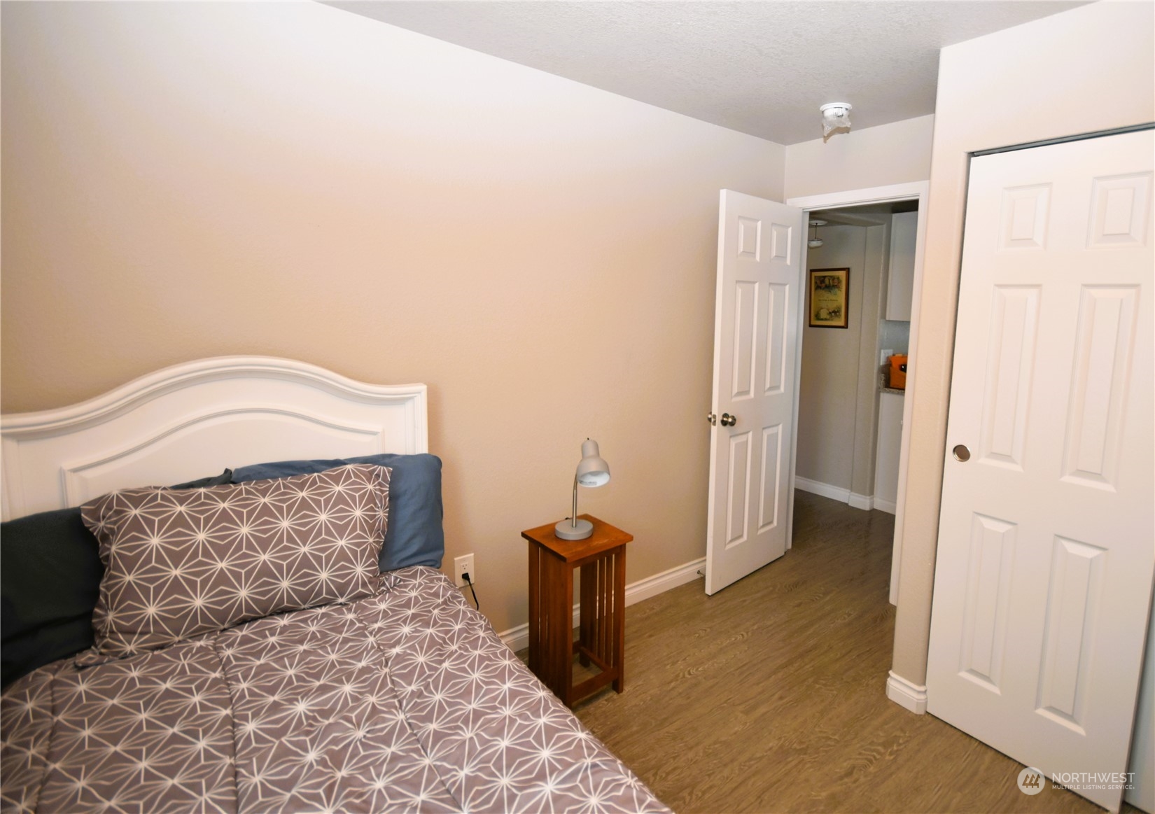 8124 East Daniels Loop Port Orchard, WA 98366 - Photo 14 of 24 a bedroom with a bed and a view of bathroom