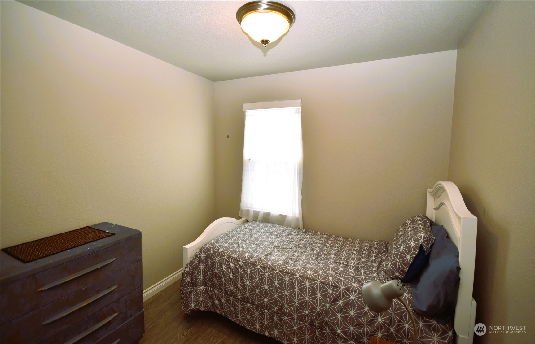 8124 East Daniels Loop Port Orchard, WA 98366 - Photo 18 of 24 a bedroom with a bed and a window