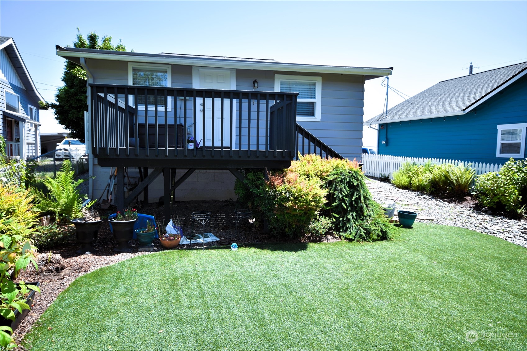 8124 East Daniels Loop Port Orchard, WA 98366 - Photo 22 of 24 a view of a house with a yard and sitting area
