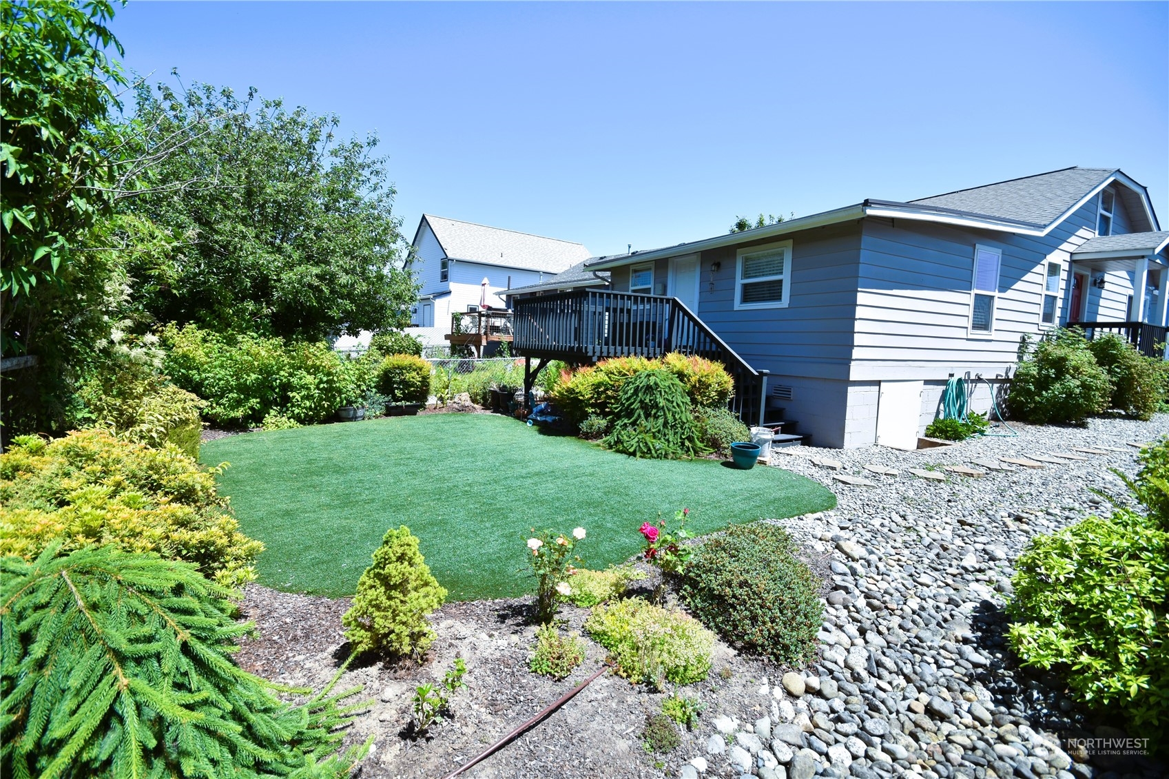 8124 East Daniels Loop Port Orchard, WA 98366 - Photo 23 of 24 a front view of a house with a yard