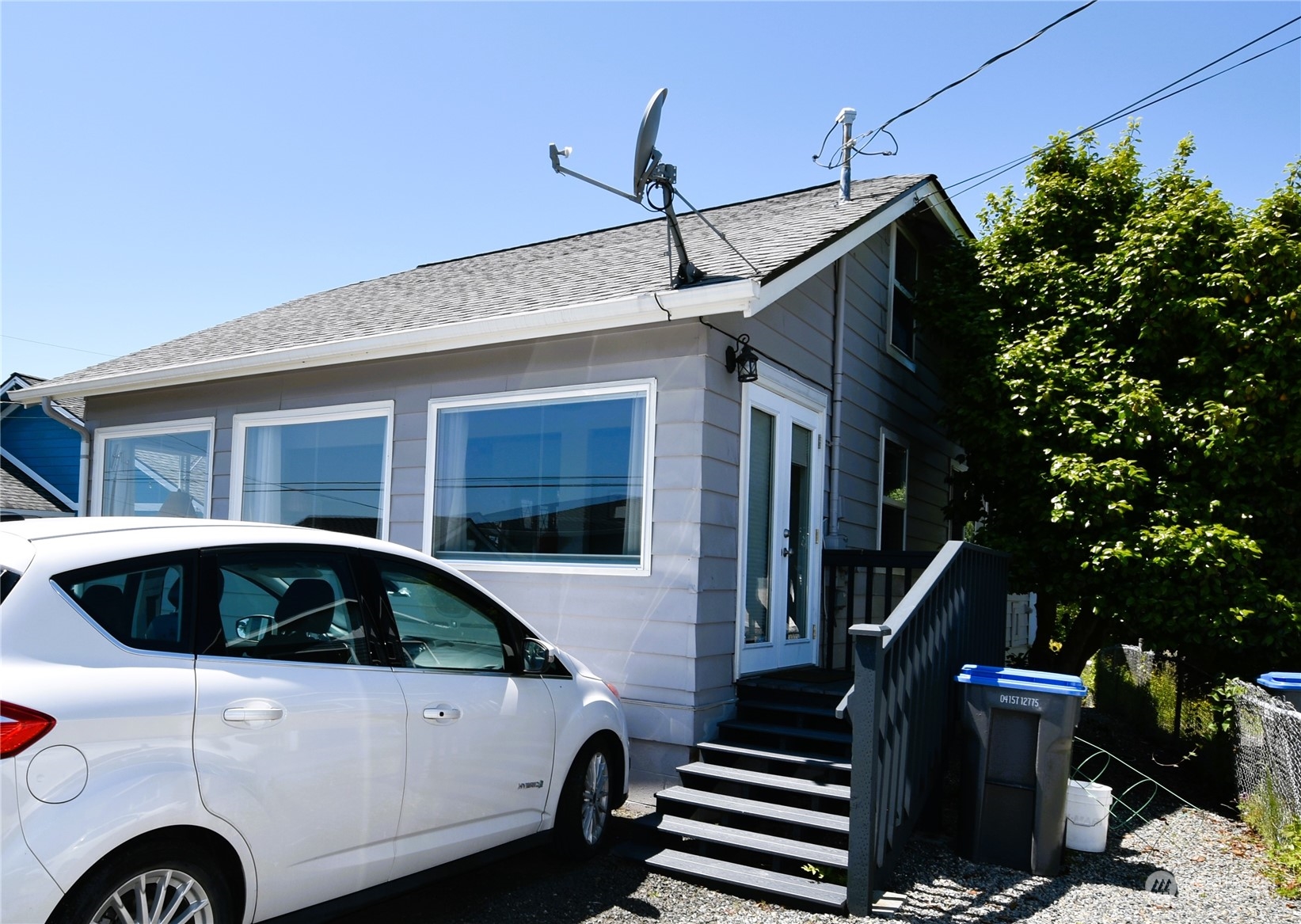 8124 East Daniels Loop Port Orchard, WA 98366 - Photo 3 of 24 a front view of a house with parking space