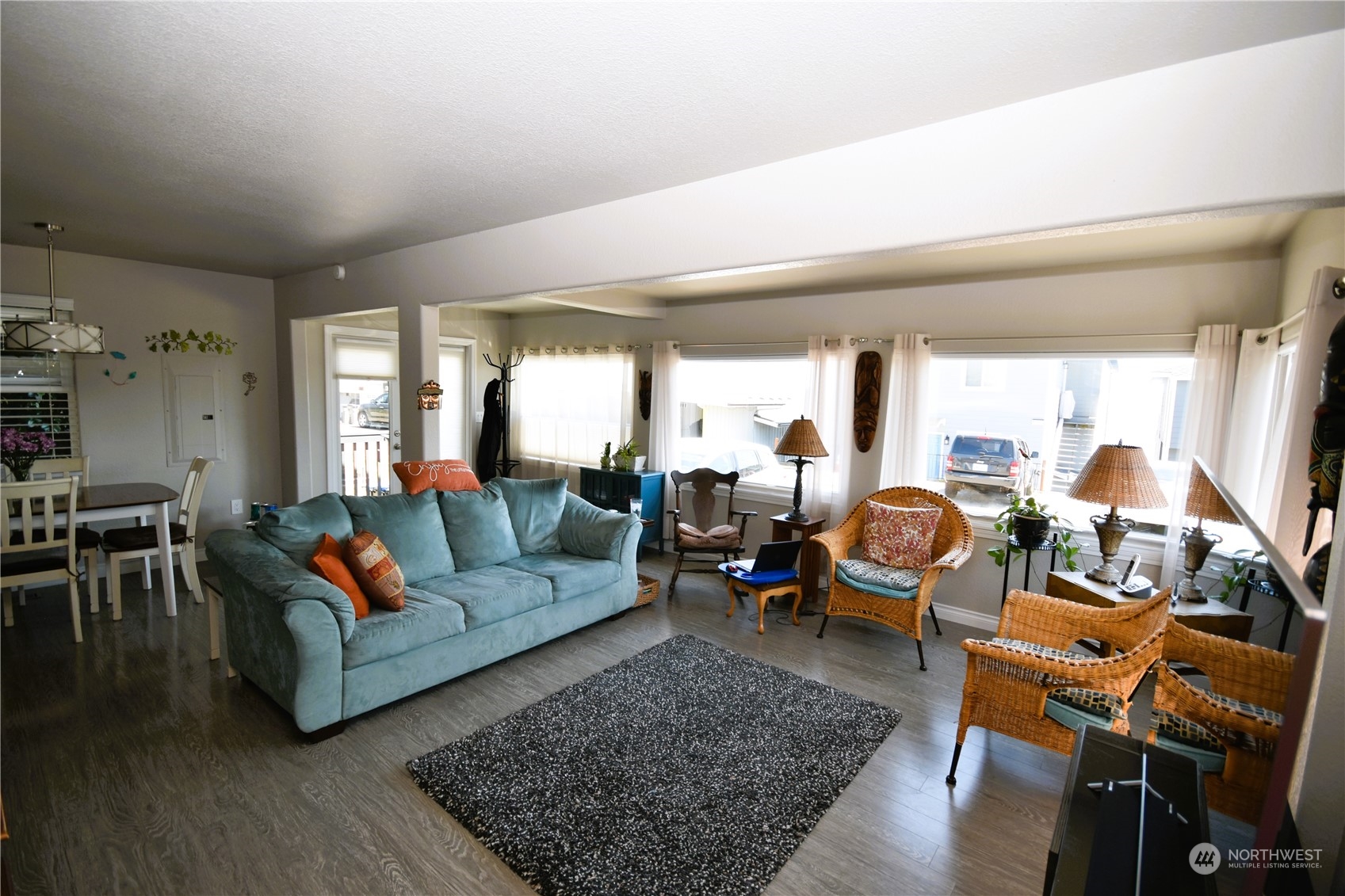 8124 East Daniels Loop Port Orchard, WA 98366 - Photo 10 of 24 a living room with furniture a rug and a table