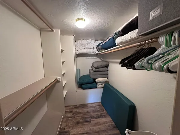 a hallway with front door and wooden floor