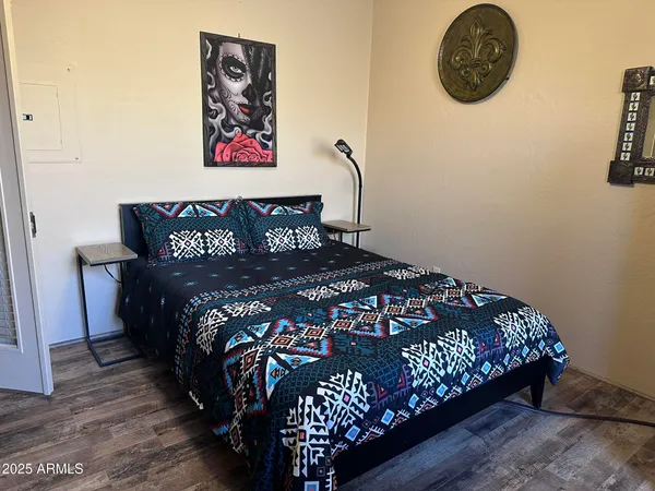 a bed sitting in a bedroom next to a small yard