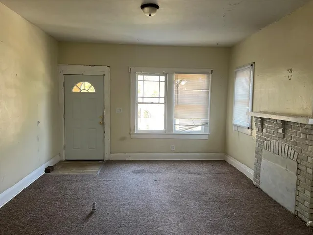 wooden floor and window in an empty room