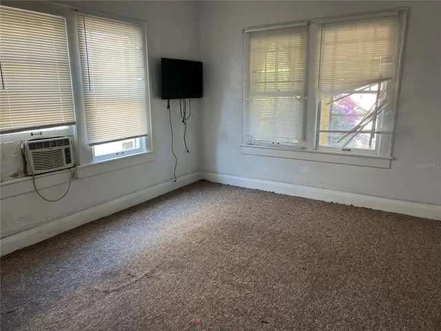a view of an empty room with a window