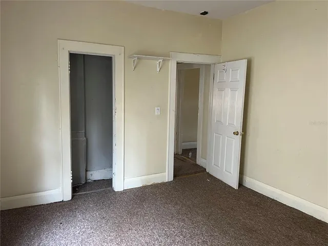 a bathroom with a sink a window and a toilet