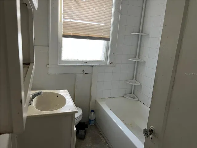 a bathroom with a toilet and a sink