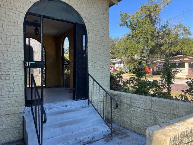a view of balcony and wooden floor