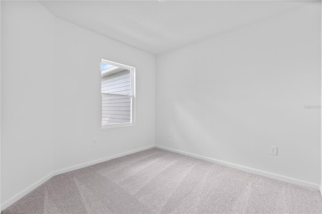 624 Poppy Lane Dundee, FL 33838 - Photo 15 of 23 a view of an empty room with a window