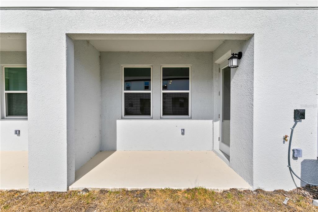 624 Poppy Lane Dundee, FL 33838 - Photo 20 of 23 a view of a bedroom with a bed and wooden floor