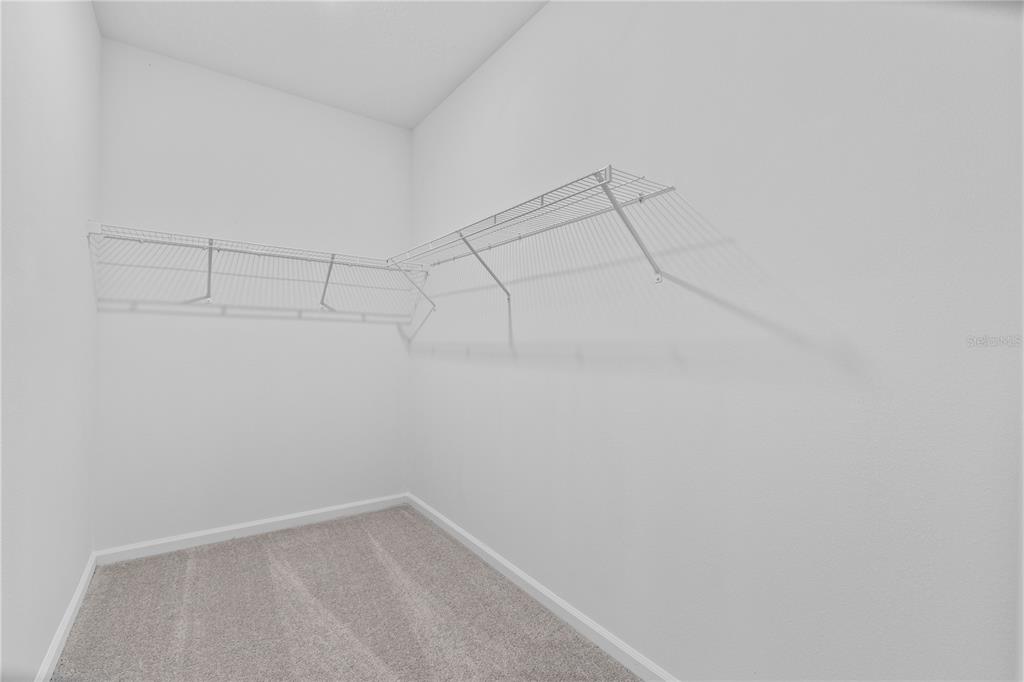 624 Poppy Lane Dundee, FL 33838 - Photo 10 of 23 a view of a room with racks on the wall