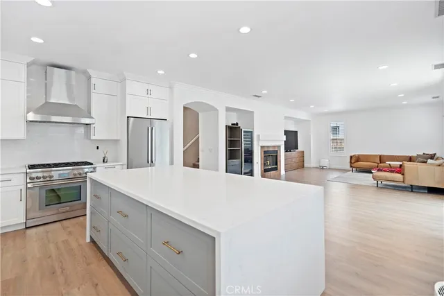 a large kitchen with stainless steel appliances