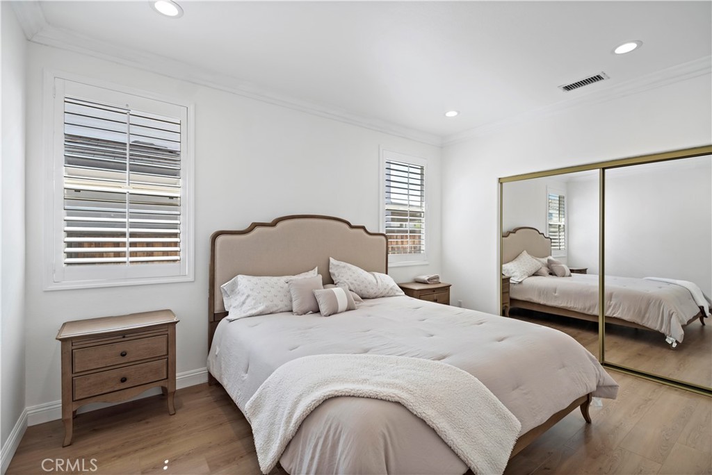 11855 Modena Drive Rancho Cucamonga, CA 91701 - Photo 14 of 30 a bedroom with a bed and a window