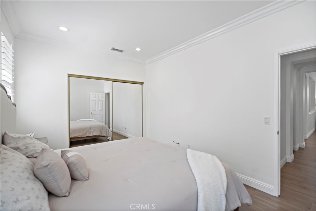 11855 Modena Drive Rancho Cucamonga, CA 91701 - Photo 15 of 30 a bedroom with a bed and a painting on the wall