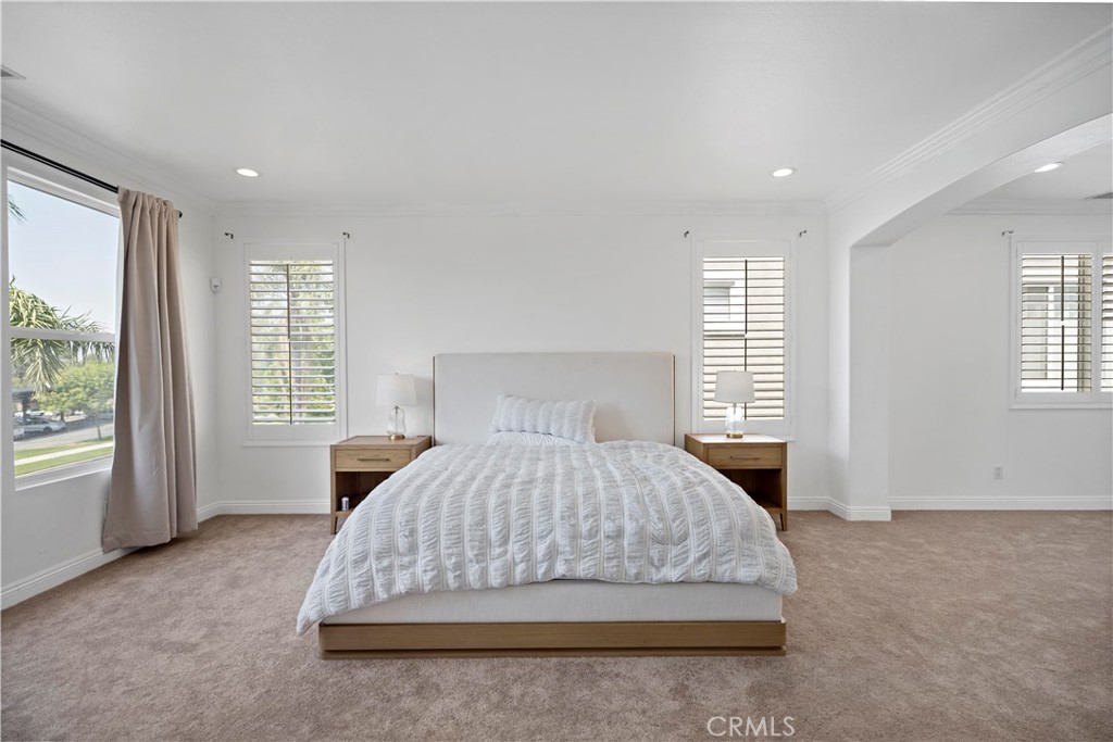 11855 Modena Drive Rancho Cucamonga, CA 91701 - Photo 16 of 30 a bedroom with a large bed and a window