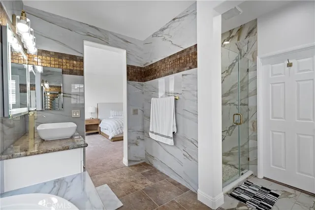 a bathroom with a tub shower and sink