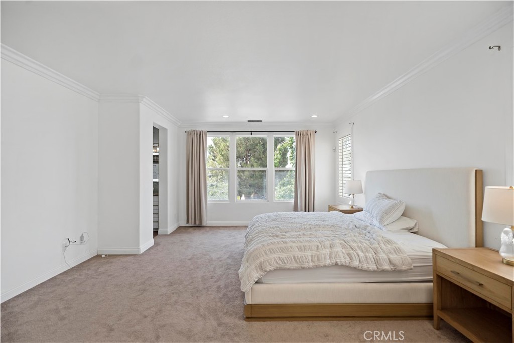 11855 Modena Drive Rancho Cucamonga, CA 91701 - Photo 21 of 30 a large bed sitting in a bedroom next to a window