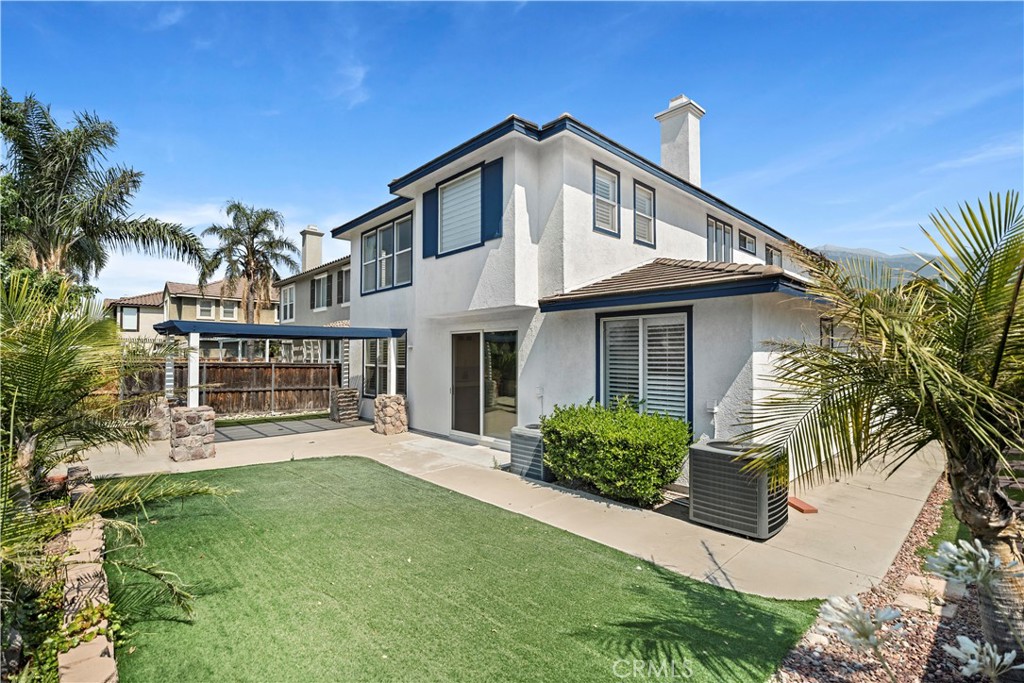 11855 Modena Drive Rancho Cucamonga, CA 91701 - Photo 29 of 30 a front view of a house with a yard