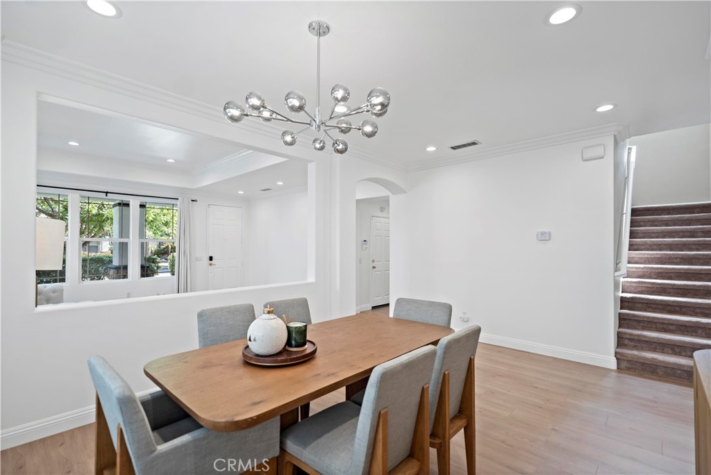 11855 Modena Drive Rancho Cucamonga, CA 91701 - Photo 7 of 30 a view of a dining room with furniture wooden floor and chandelier