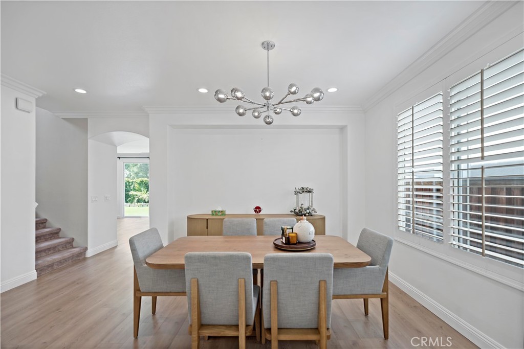 11855 Modena Drive Rancho Cucamonga, CA 91701 - Photo 8 of 30 a view of a dining room with furniture window and wooden floor