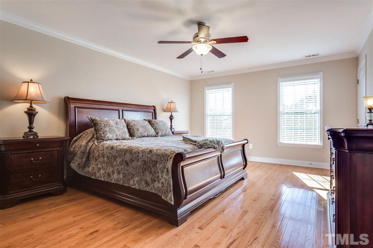 9004 Shellwood Court Raleigh, NC 27617 - Photo 12 of 25 a bedroom with a bed and window