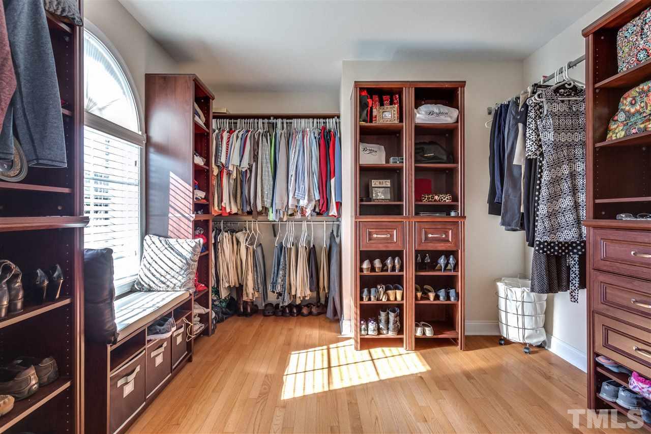 9004 Shellwood Court Raleigh, NC 27617 - Photo 14 of 25 a view of walk in closet with clothes and shoes