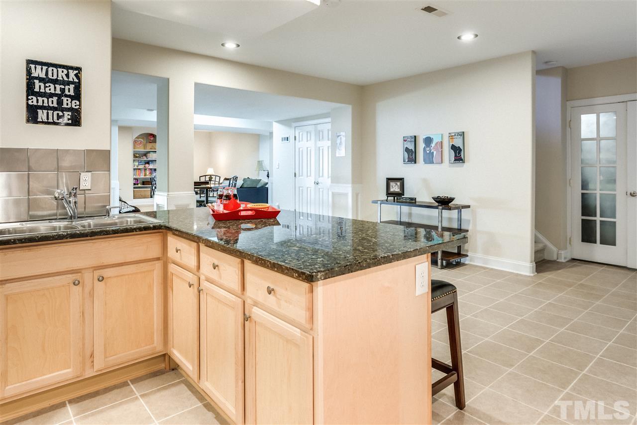9004 Shellwood Court Raleigh, NC 27617 - Photo 19 of 25 a kitchen with stainless steel appliances granite countertop a sink and cabinets